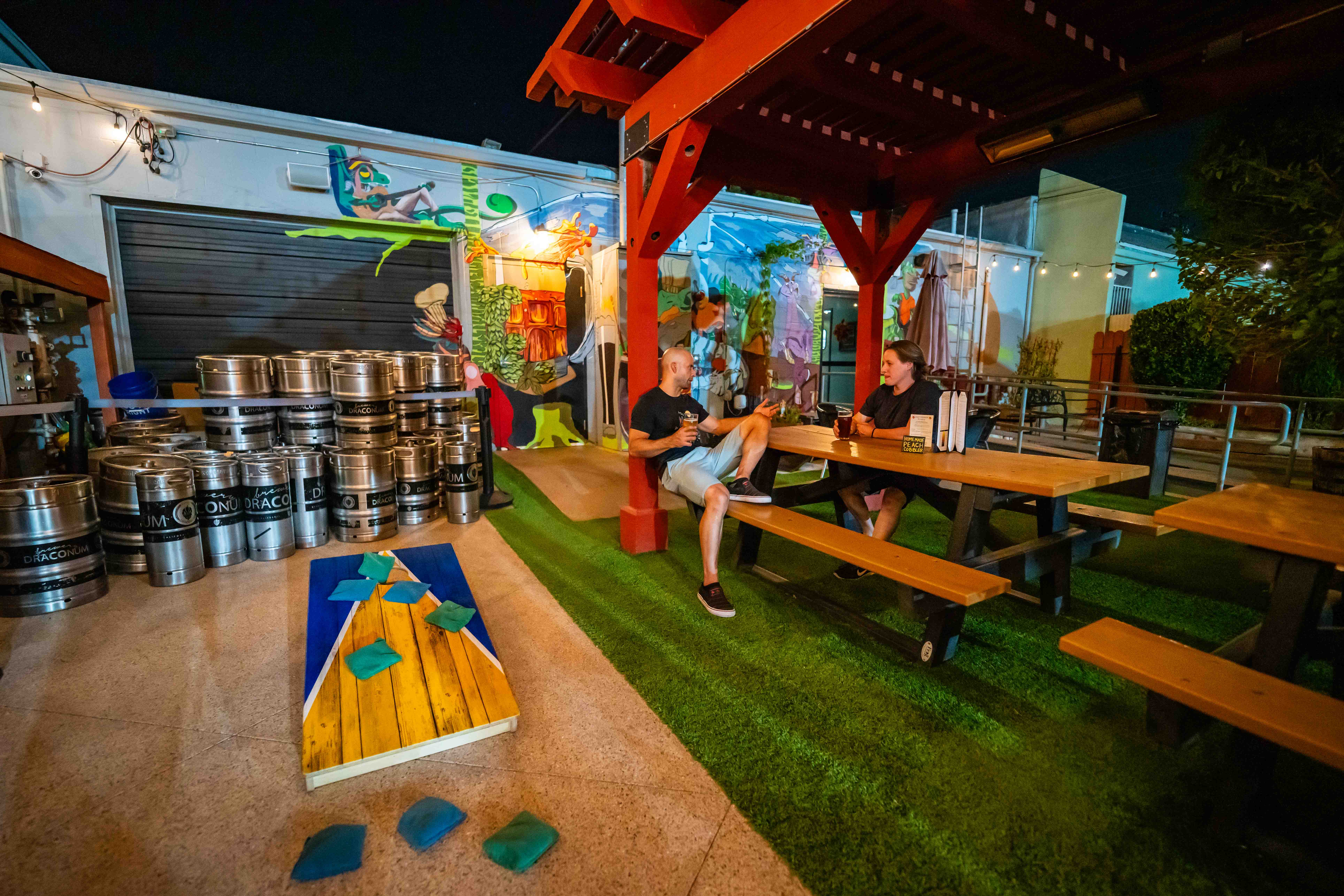 Outdoor patio at Brewery Draconum at night