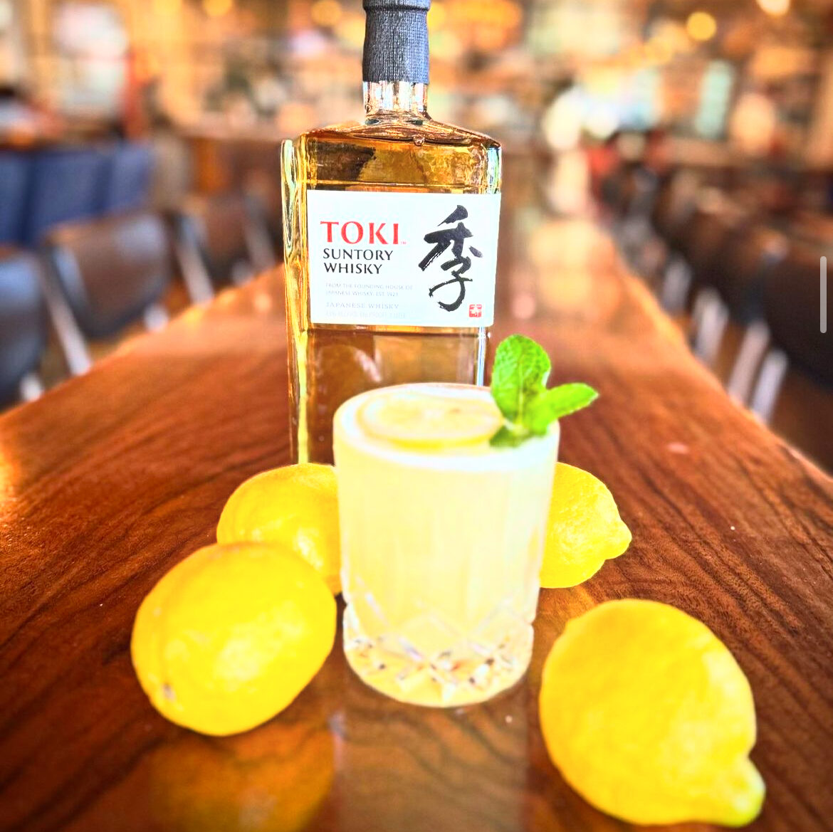 lemon-infused old-fashion and Japanese Toki Suntory Whiskey bottle at Old Town Junction