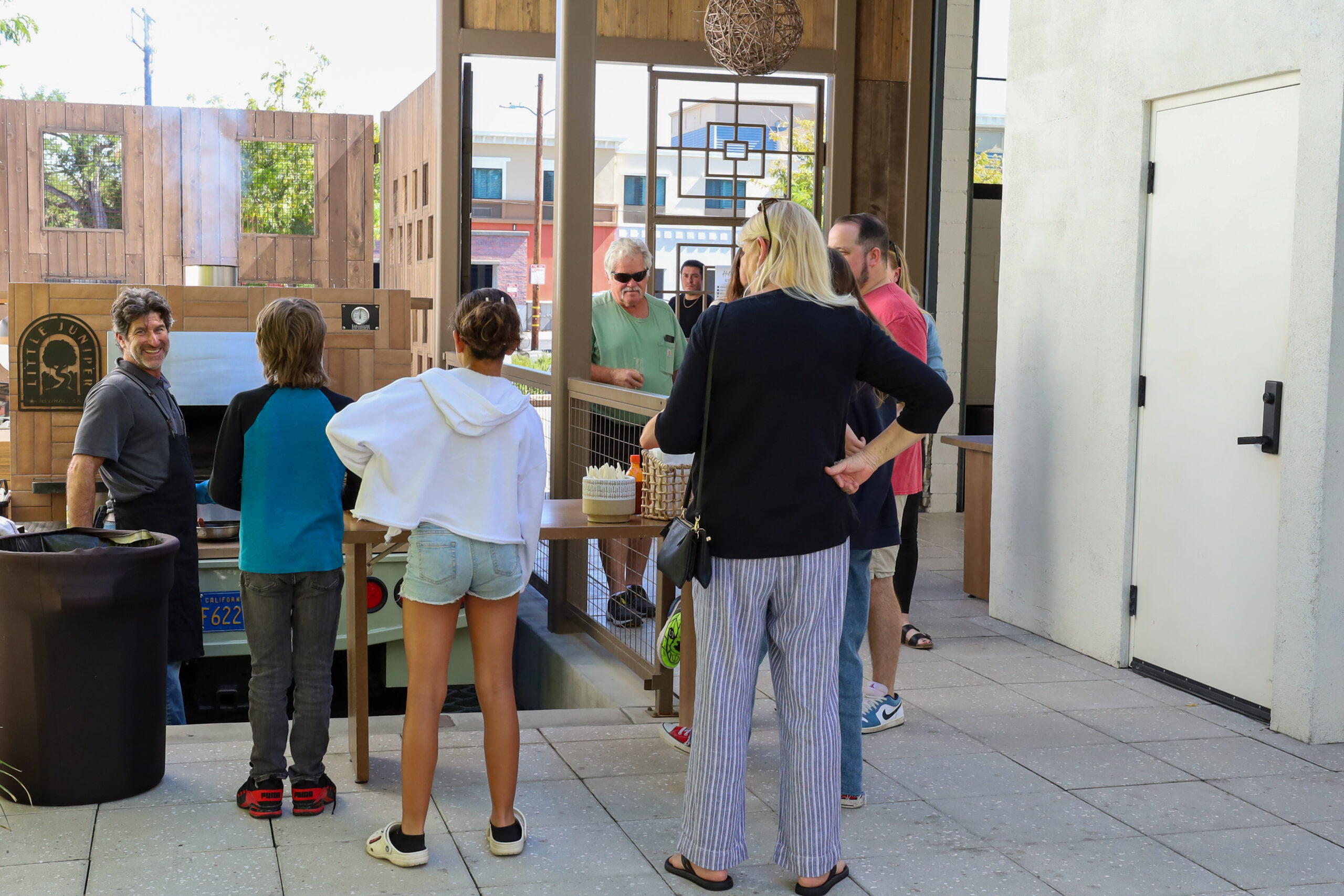 Catering area at Hart & Main in Newhall, California, showing guests and staff preparing for an event.